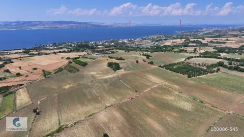 ÇANAKKALE LAPSEKİ SULUCA BOĞAZ VE KÖPRÜ MANZARALI SATILIK TARLA